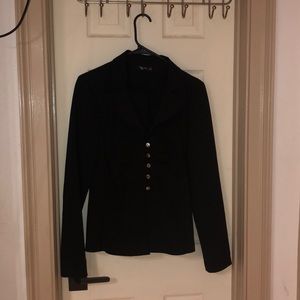 Matching button up blazer and knee length skirt.